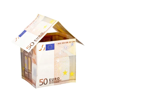 Дом евро из банкнот на белом фоне — стоковое фото