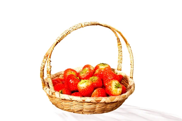 Basket with strawberries on a white background — Stok fotoğraf