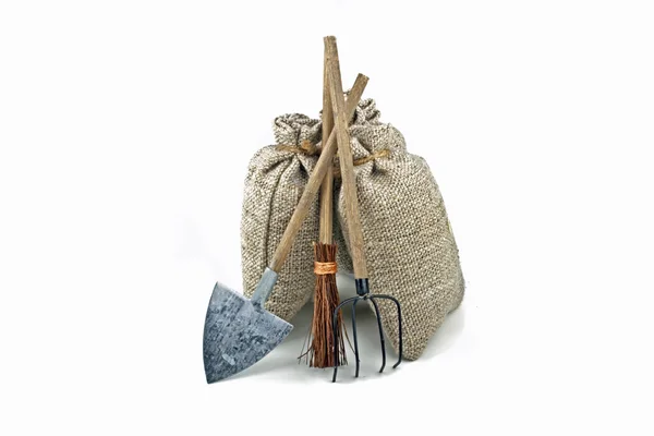 Potatoe bags with tools — Stock Photo, Image