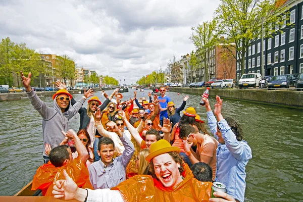 AMSTERDAM, NETHERLANDS - APRIL 30: in orange cruising thr — Stock Photo, Image