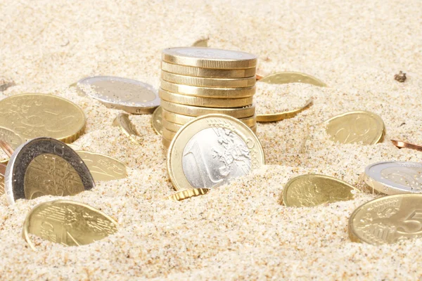 Euro coins in the sand — Stock Photo, Image