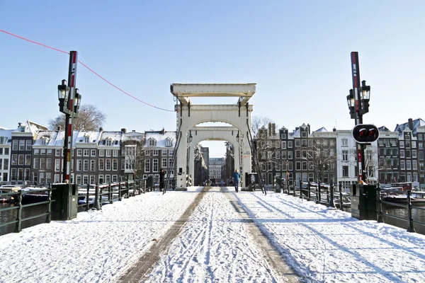 Snowy thiny bridge in Amsterdam the Netherlands in winter — Stock Photo, Image