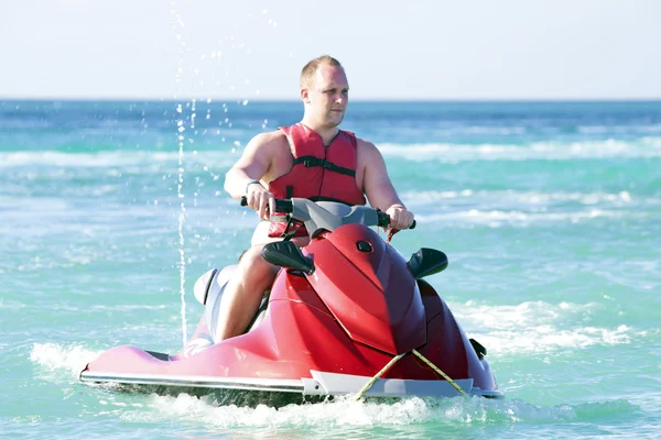 Young guy on a jet ski — Stock Photo, Image