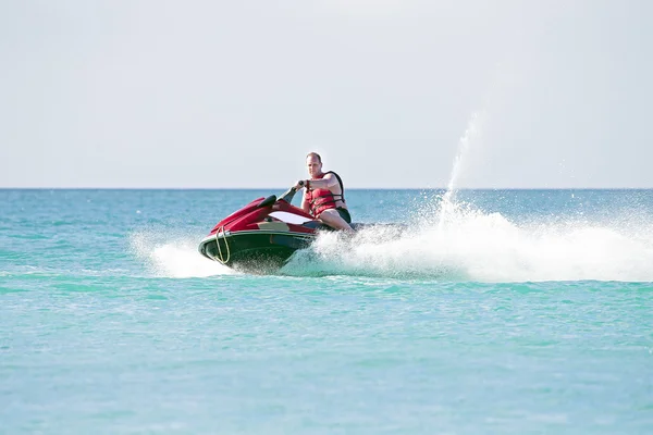 Guy cruising on the caribbean sea — Stock Photo, Image