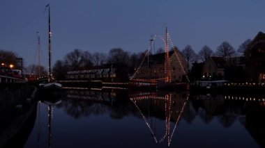 The traditional city Dokkum at christmas time in the Netherlands at twilight
