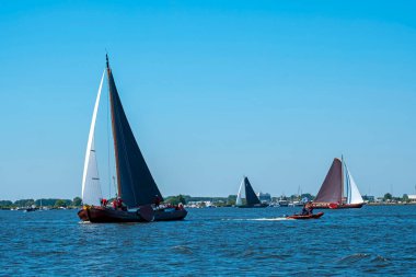 Traditional Frisian wooden sailing ships in a yearly competition in the Netherlands