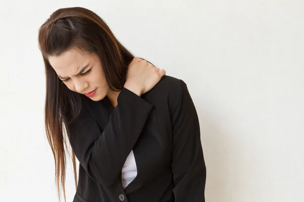 Heavy shoulder pain or stiffness of female business executive — Stock Photo, Image