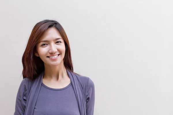 Happy woman looking at blank background with text or copy space — Stock Photo, Image