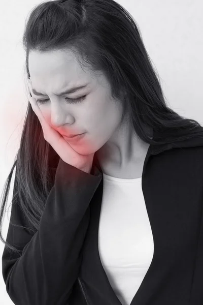 Woman suffers from toothache, with red alert danger accent — Stock Photo, Image