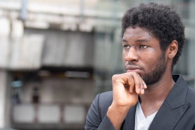 Black African business man thinking about business plan, career path, finding a new job
