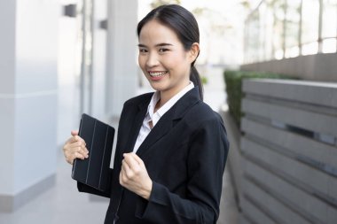 Healthy happy vaccinated asian office worker or business woman not wearing face mask, concept of herd immunity achievement, lifting pandemic restriction