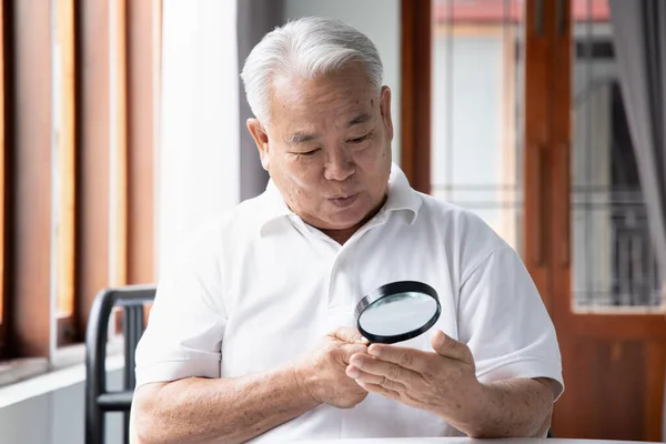 Excited Old Senior Male Fortune Teller Doing Palmistry Fortune Telling — Stockfoto