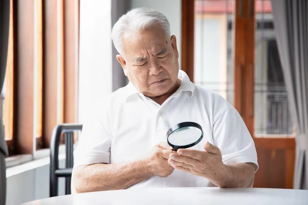 Unhappy Old Senior Male Fortune Teller Doing Palmistry Fortune Telling — Stockfoto