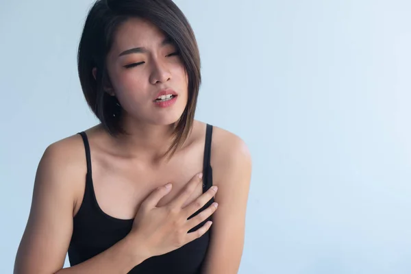 woman suffering from sudden heart attack, concept of heart disease awareness month