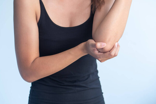 woman with elbow joint pain symptoms, concept of office syndrome or tennis elbow