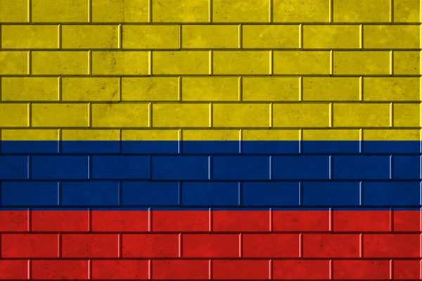 Bir tuğla duvara boyalı Kolombiya bayrağı — Stok fotoğraf