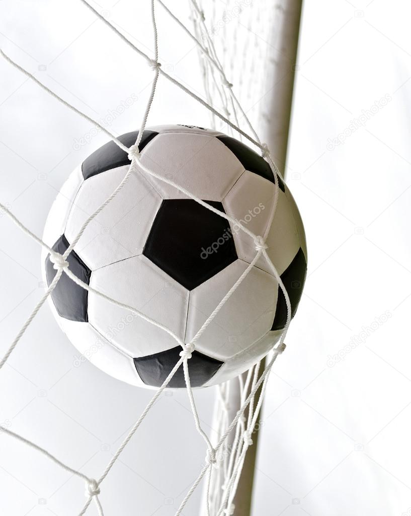 a soccer ball in the goal