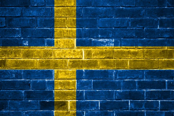 Bandera de Suecia pintada en una pared de ladrillo —  Fotos de Stock