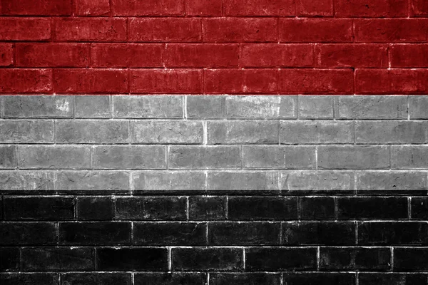 Jemen flaggan målad på en tegelvägg — Stockfoto