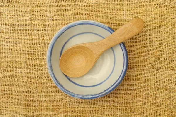 Wooden dish and spoons on table — Stock Photo, Image