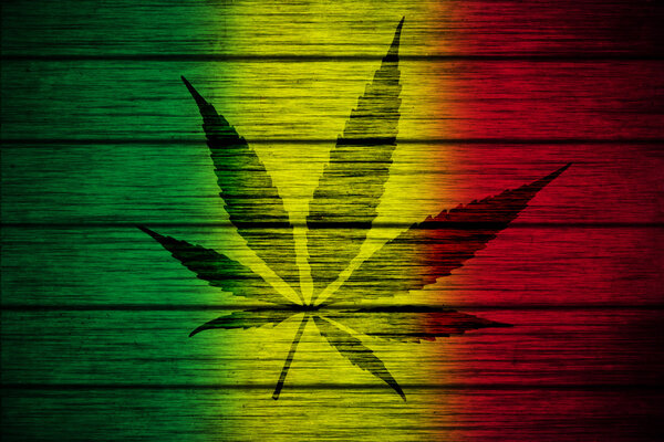 Background texture wood Rasta Flag with Marijuana Leaf silhouette