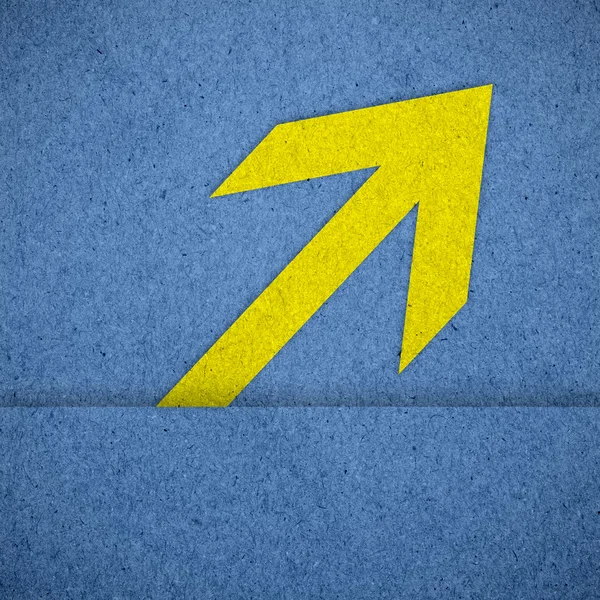Arrow on blue paper texture — Stock Photo, Image
