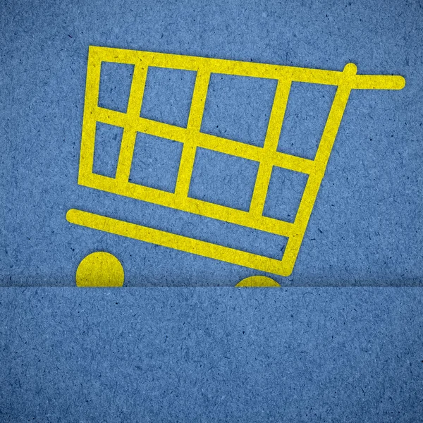 Iconos del carrito de compras en textura de papel azul —  Fotos de Stock