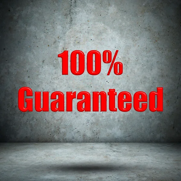 Guaranteed on concrete wall — Stock Photo, Image