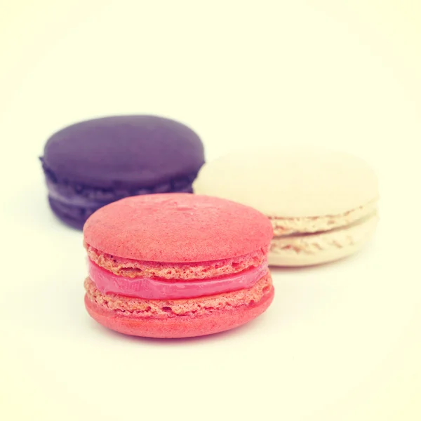 Sweet and colourful french macaroons on retro-vintage background — Stock Photo, Image