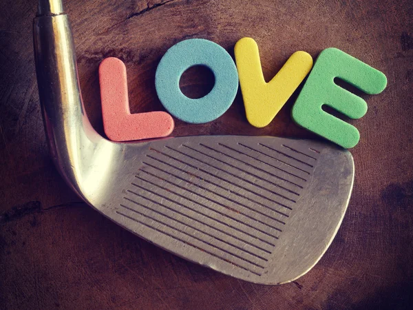 Golfa miłości na tle drewna starym stylu retro starodawny — Zdjęcie stockowe