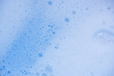 Soyut arka plan beyaz sabunlu köpük dokusu. Köpüklü şampuan köpüğü.