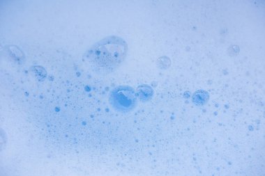 Soyut arka plan beyaz sabunlu köpük dokusu. Köpüklü şampuan köpüğü.