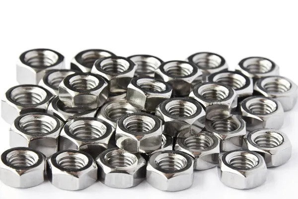 Pile of stainless steel nuts — Stock Photo, Image