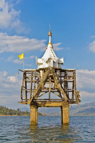 Part of ruin of Thai church bell tower expose in the river — Stock Photo, Image