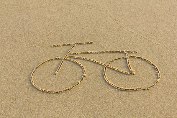 A bicycle drawing on the sand