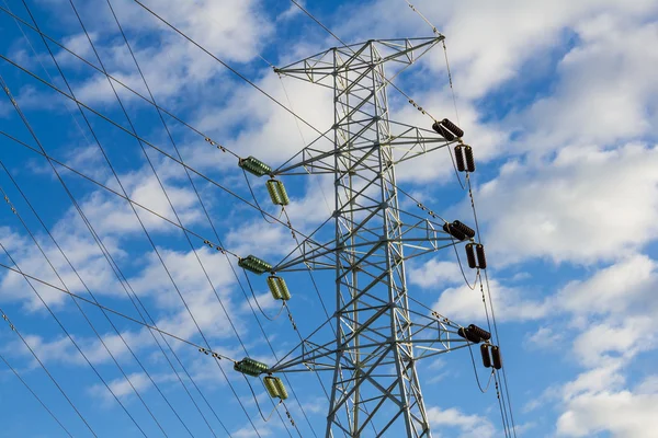 High voltage power transmission lines and pylon — Stock Photo, Image