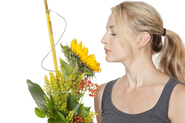 Blond woman with sunflower — Stock Photo, Image