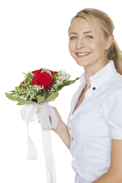 Blond woman with a bouquet of red roses — Stock Photo, Image