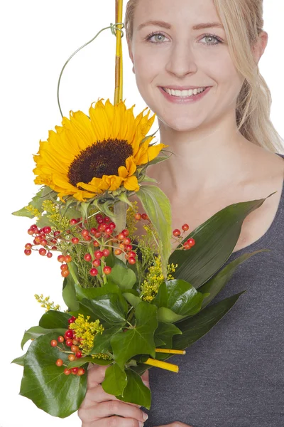 Blond woman with sunflower bouquet — Stock Photo, Image