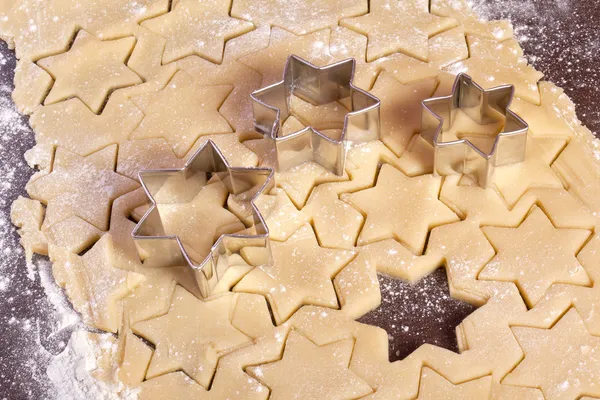Cutting cookies dough star shape — Stock Photo, Image