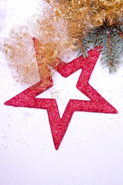 Christmas decoration with red star golden tinsel — Stock Photo, Image