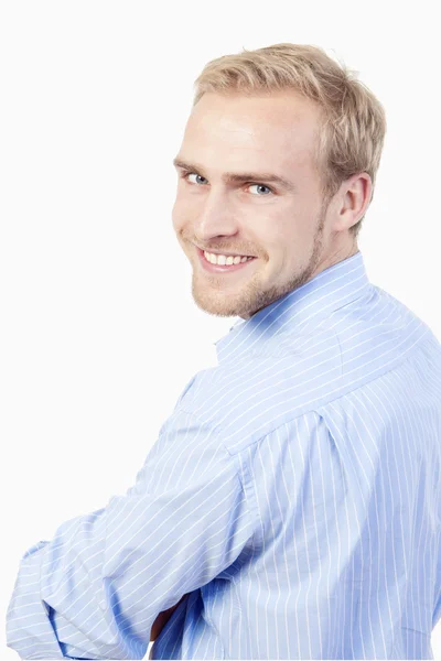 Portret van een jonge man glimlachend — Stockfoto