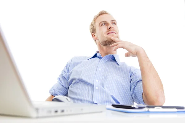 Young man at office daydreaming — Stock Photo, Image