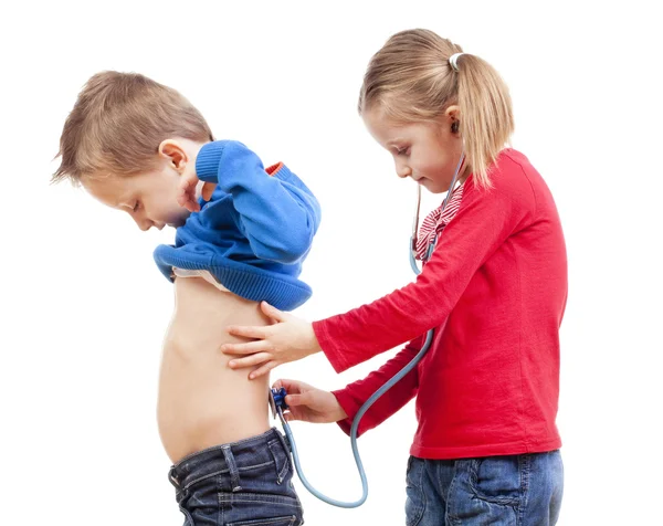 Brother and sister playing a doctor — Stock Photo, Image