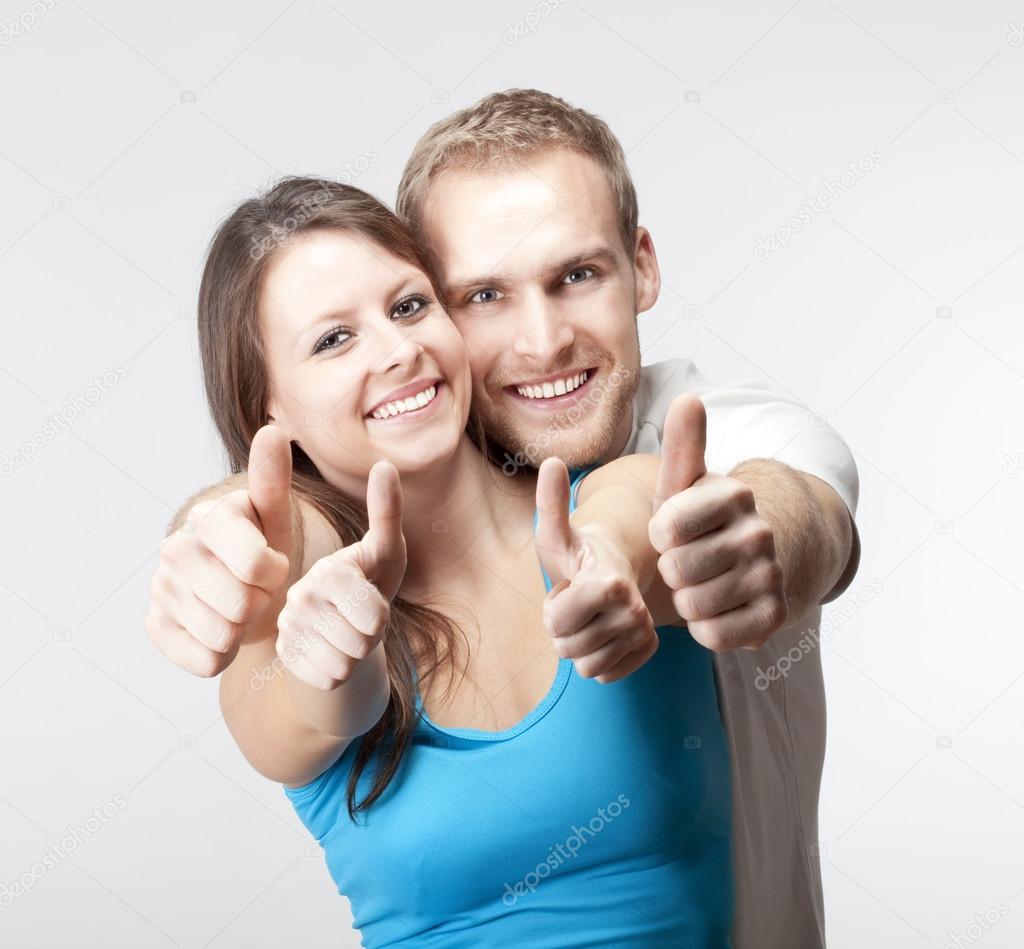 couple showing thumbs up