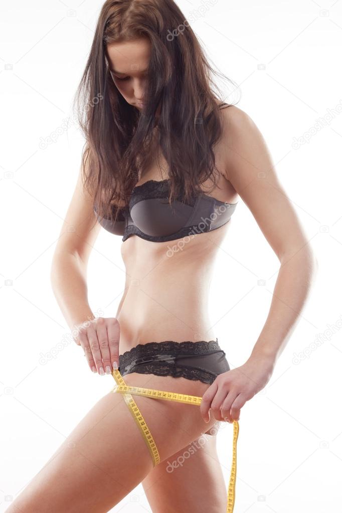 Girl measuring results of diet