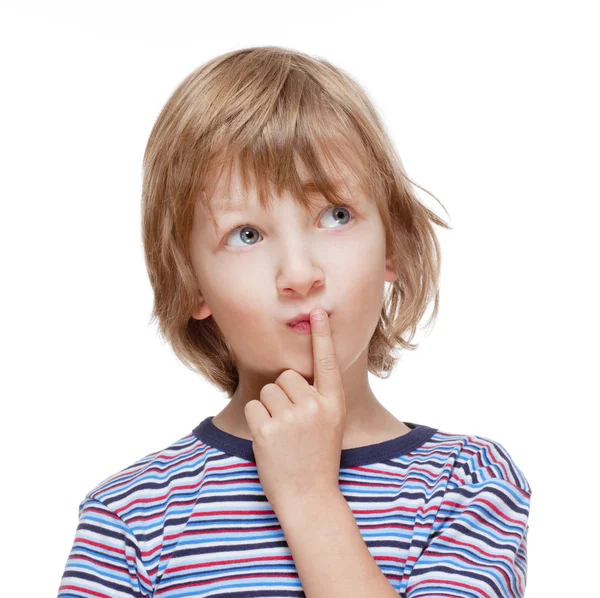 Boy Looking up Thinking, Finger on his Mouth Stock Image