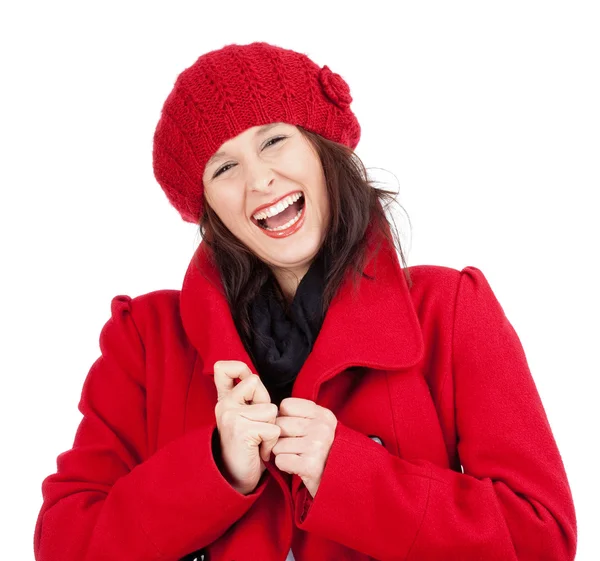Νεαρή γυναίκα στο κόκκινο παλτό και καπάκι — Φωτογραφία Αρχείου