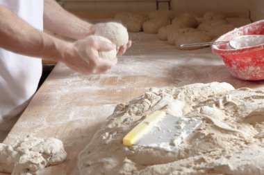 Baker Working with Dough. clipart
