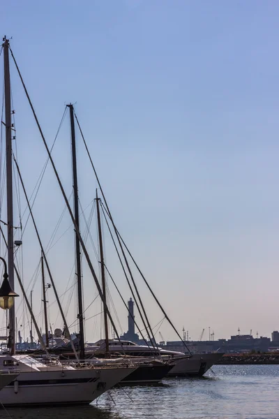 Ship with Genoa lighthouse in background — Stock Photo, Image